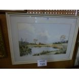 A framed and glazed watercolour study of a countryside landscape with pond to foreground signed