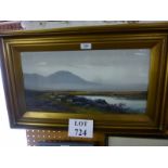 A framed and glazed oil study of a mountainous countryside landscape with grazing sheep signed