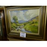 A framed oil on canvas depicting a river flowing through a countryside landscape signed L Nesbitt