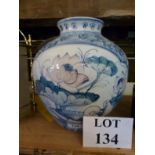 A Chinese bulbous blue and white vase with poly chrome duck and lily pad decoration est: £30-£50