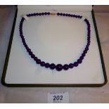 An amethyst necklace 14ct gold clasp (54