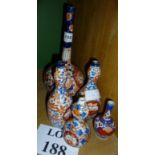 Five Imari bottle or spill vases decorat