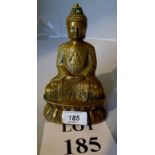 A gilt brass Buddha seated on a lotus es