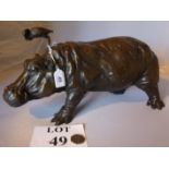 A bronze of a large hippopotamus with a