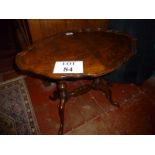 A burr yew occasional table with scallop