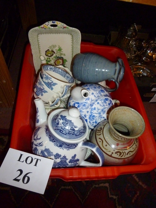 A large box of assorted ceramic teapots,