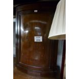 A 19c mahogany corner wall cupboard in v