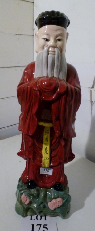 A large Chinese figure of a wise man es