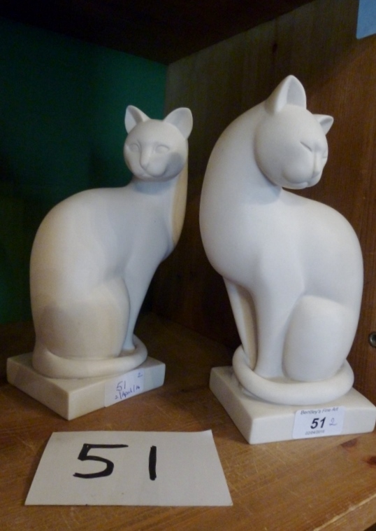 A pair of marbleized cats est: £80-£120