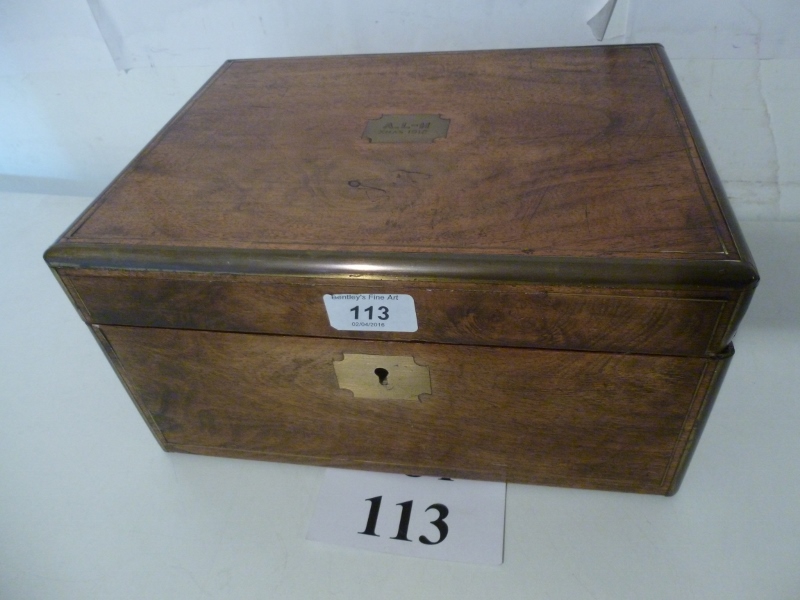 A brass bound oak writing box with engra