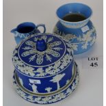 A blue and white Jasperware stilton or cheese dish and cover decorated in the typical classical