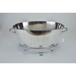 A large silver plated oval twin handled champagne or bottle cooler with lion paw feet est: