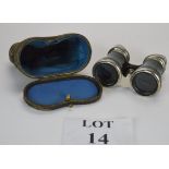 A pair of vintage leather covered and chrome opera or field glasses,