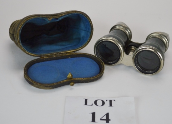A pair of vintage leather covered and chrome opera or field glasses,