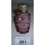 A Victorian red overlay cut glass scent bottle with internal stopper est: £100-£140