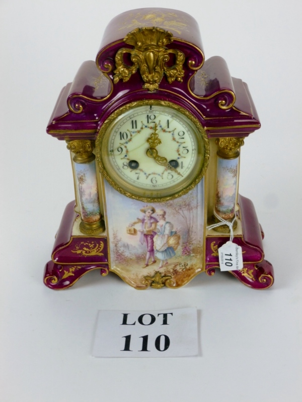 A decorative French porcelain mantle clock painted with Sevres style figural scenes,