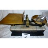 A set of Mattocks & Sons marble and brass scales with weights;