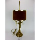 A brass three light table lamp in the art nouveau style est: £40-£60 (G1)