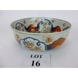A Chinese blue and white punch bowl with polychrome enamel and gilt floral and bird decoration,