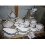 A Royal Doulton Baronett pattern part dinner and coffee service to include two tureens and covers