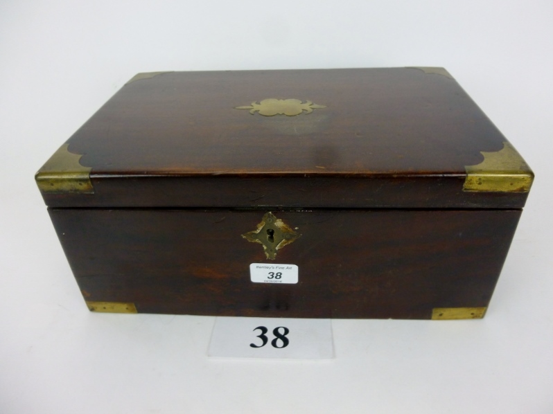 A late 19th/early 20th century mahogany and brass bound writing box with leather lined slope and