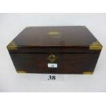 A late 19th/early 20th century mahogany and brass bound writing box with leather lined slope and