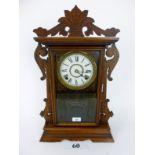 An American Seth Thomas Clock Co walnut cased parlour gingerbread shelf clock,