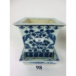 An Oriental blue and white square planter and stand decorated with dragon decoration est: £50-£80