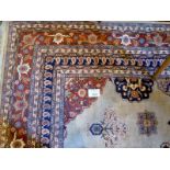 A 20c large wool carpet with central motif on caramel ground (390 x 290 cm approx) est: £350-£450