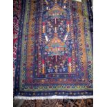 A 20c Persian part silk rug on blue ground hand knotted est: £80-£120