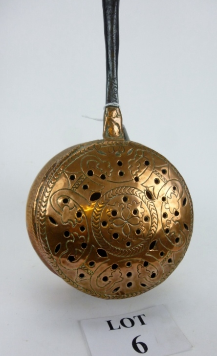 A mid-17th century Southern Continental copper warming pan of deep design, probably Italian,