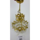 A tiered gilt metal and crystal drop hanging ceiling wall light est: £15-£25 (E)