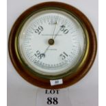 A Scottish oak and brass cased Ship's aneroid barometer by Kelvin Bottomley & Baird Ltd, Glasgow c.