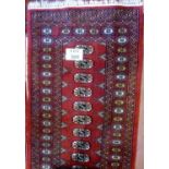 A 20c small Persian design runner on red ground (190 x 65 cm approx) est: £45-£65