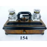 A Victorian walnut and ebonised writing set with two ink-wells est: £30-£50 (N2)