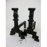 A pair of cast iron fire dogs, with Tudor rose and crown decoration,