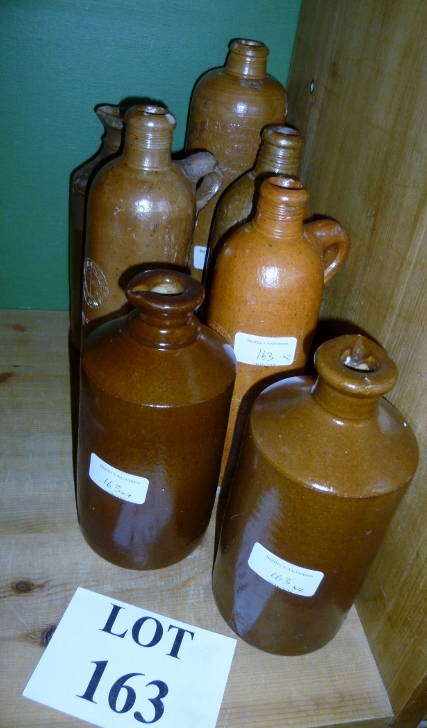 Seven assorted stoneware bottles est: £2