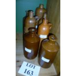 Seven assorted stoneware bottles est: £2