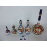 Five Imari bottle or spill vases decorat