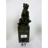 A hot-cast bronze model of a bear on bla