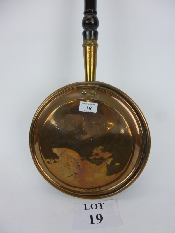 An early 19th century copper warming pan