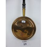 An early 19th century copper warming pan