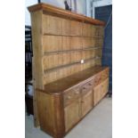 A large Victorian pine dresser with pane