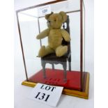 An early Teddy bear in glass case est: £