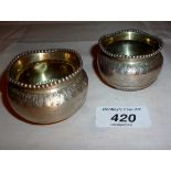 A pair of Victorian silver circular salt