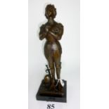 A patinated bronze sculpture of Joan of