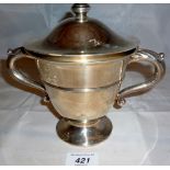 A two handled silver trophy and cover Sh