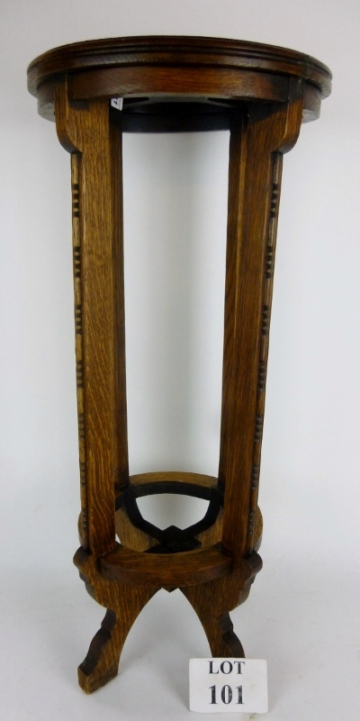 An oak umbrella or stick stand in the ar