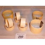 A collection of six ivory napkin rings a