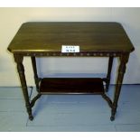 An Edwardian mahogany side table with tu